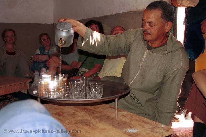 Pictures of Morocco -   pouring tea in a Berber village near Marrakech