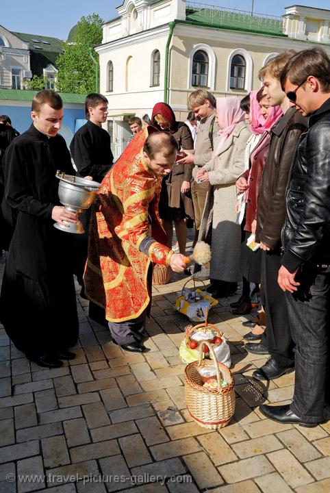 Pictures of Ukraine - Kyiv, Kiev, St Michael's Monastery, priest blessing at the Easter celebration