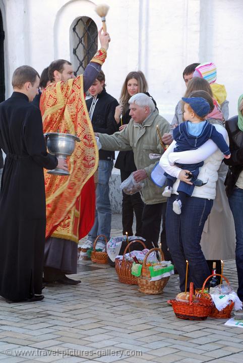 Pictures of Ukraine - Kyiv, Kiev, St Michael's Monastery, priest blessing at the Easter celebration