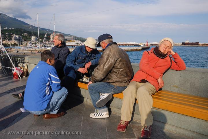Pictures of Ukraine - people playing chess and relaxing, Yalta harbour