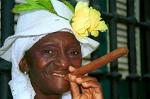 woman in traditional clothing with a cigar, Havana