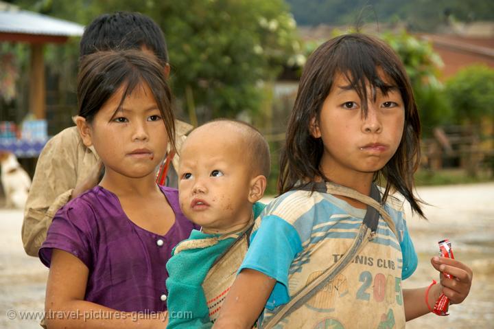 Pictures of Laos - North-Laos-0010 - little girl with a baby on her back