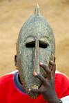 boy showing a mask, Djenne market