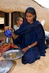 Tuareg girl pouring tea