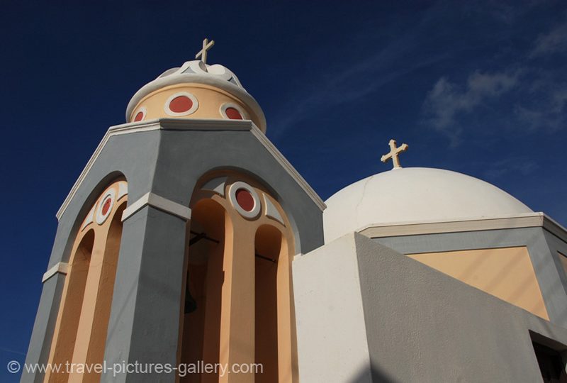 Greece - Santorini - colourful church, azure blue skies, Fira